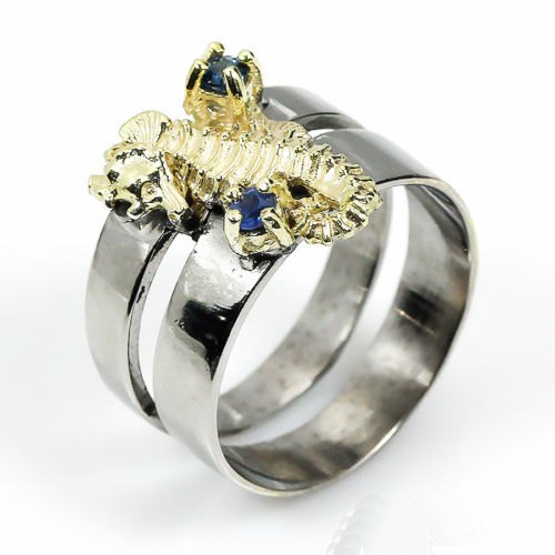 טבעת עבודת יד בשיבוץ ספיר כחול כסף וציפוי זהב